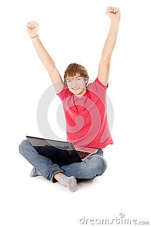 Beautiful guy sitting for the laptop and happy raising a hand in Stock Photo