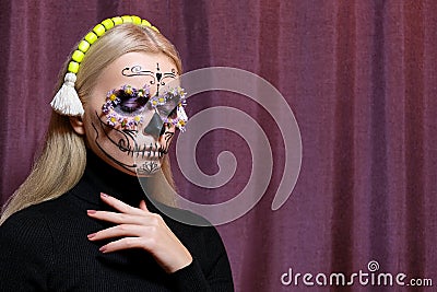 Halloween Make-Up Style, Fancy Dress and Diadem. Blond Model Wear Sugar Skull Makeup with Crown. Santa Muerte concept Stock Photo