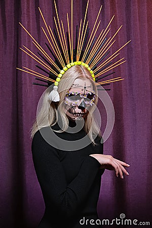 Halloween Make-Up Style, Fancy Dress and Diadem. Blond Model Wear Sugar Skull Makeup with Crown. Santa Muerte concept Stock Photo