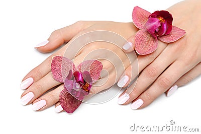 Beautiful hand with nail manicure and orchid Stock Photo