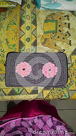 Beautiful handmade knitted purse in gray with pink roses flowers from asia Stock Photo