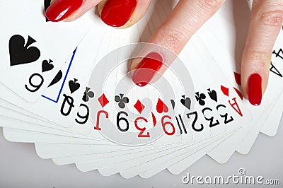 Beautiful hands with perfect manicure and cards Stock Photo