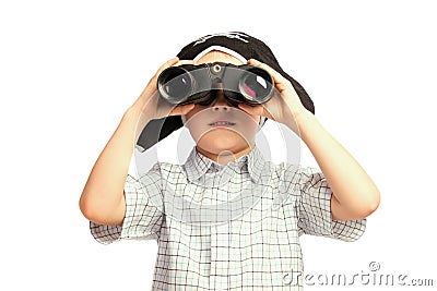 Child in pirate hat looking in binoculars Stock Photo