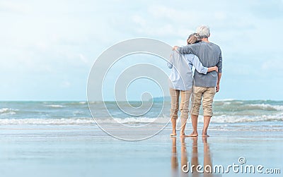 Beautiful happy elderly couple rest at tropical resort,back view Stock Photo