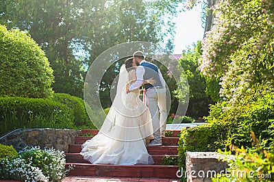 Beautiful happy just married couple kissing Stock Photo