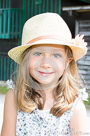 Happy little girl outdoors smile and child straw hat Stock Photo