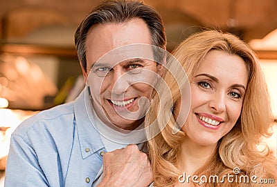 Beautiful happy mature couple looking at camera Stock Photo