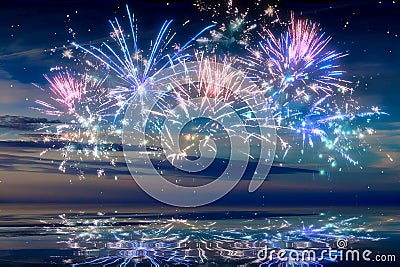 Beautiful happy new year fireworks in the sky with reflections on water Stock Photo