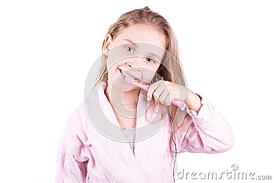 Beautiful happy smiling little girl brushing her teeth after bath, shower Stock Photo