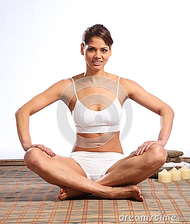 Beautiful happy woman with fit body sitting Stock Photo