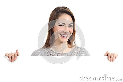 Beautiful happy woman smiling and holding a blank placard Stock Photo