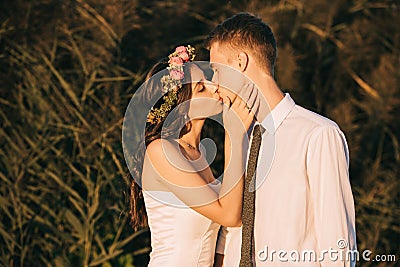 beautiful happy young tender wedding couple kissing Stock Photo