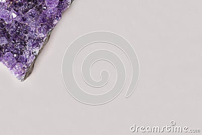 Beautiful healing semiprecious violet amethyst gemstone on white background macro close up with copy space Stock Photo
