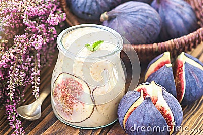 Beautiful healthy appetizer figs fruit smoothie or milk shake in glass jar with fresh figs, top view. Natural detox. Liquid ice cr Stock Photo