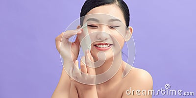 Beautiful Healthy Girl With Nude Makeup Removing Oil From Face Using Blotting Papers Stock Photo