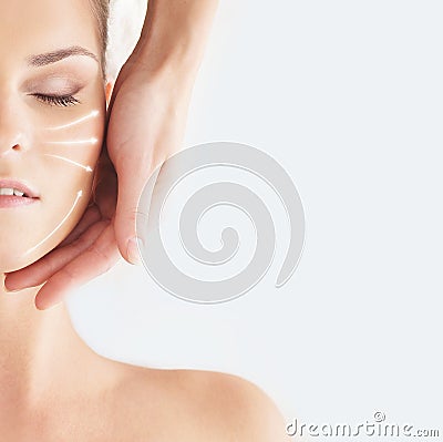 Beautiful, healthy and young woman is getting spa treatment (concept with the arrows) Stock Photo