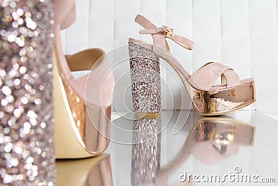 Beautiful high and thin golden stiletto heel shoes. Stock Photo