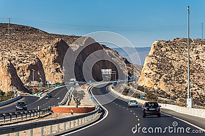 A highway among the yellow mountains is near Almeria in Spain Editorial Stock Photo