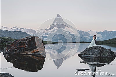 Stylish young wedding couple posing in beautiful Matterhorn moun Stock Photo