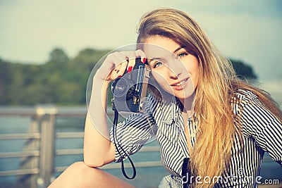 Beautiful Hipster Girl with Photo Camera Stock Photo