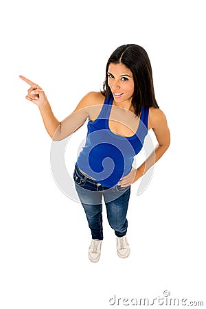 Beautiful hispanic woman pointing to copy space presenting product Stock Photo