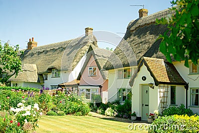 Thatched Cottages and gardens. Stock Photo