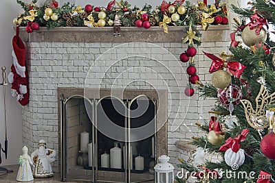 Beautiful holdiay decorated room with Christmas tree. Burning fireplace. Decorated festive fireplace with burning fire Stock Photo