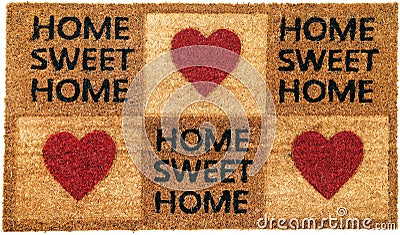 Beautiful Home sweet home peach color coir doormat with hearts Stock Photo