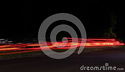 Beautiful horizontal timelapse shot of car lights at nighttime Stock Photo