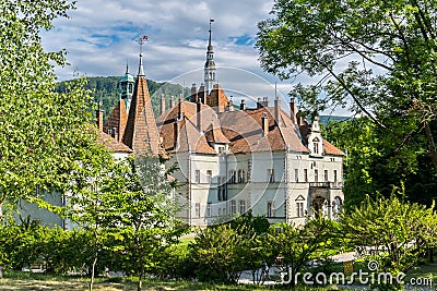 Beautiful house of ancient architecture with upstanding spiers of turrets Stock Photo