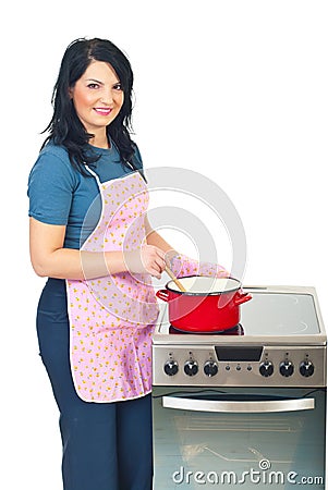 Beautiful housewife cooking Stock Photo