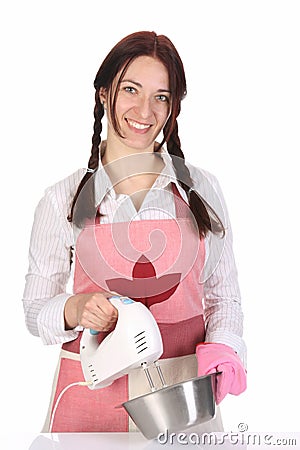 Beautiful housewife preparing with kitchen mixer Stock Photo