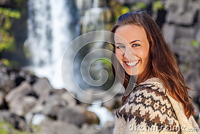 Beautiful Icelandic Woman Smilimng By A Waterfall in Northern Iceland Stock Photo