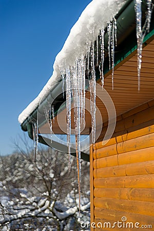Beautiful Icicle on the snow roof Stock Photo