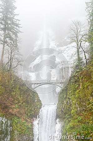 Icy Multnomah Falls Oregon in wintertime Stock Photo