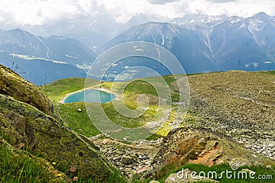 Beautiful idyllic Alps landscape with lake and mountains in summer Stock Photo