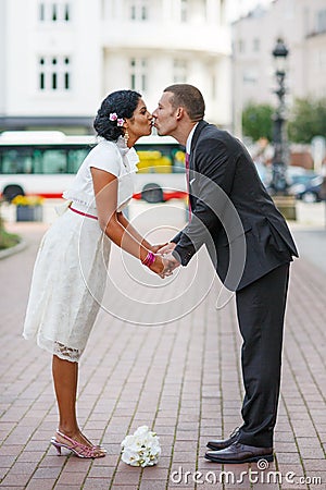 Beautiful indian bride and caucasian groom, after wedding ceremony. Stock Photo