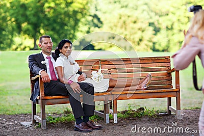 Beautiful indian bride and caucasian groom after wedding ceremon Stock Photo