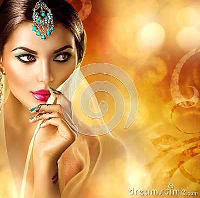 Beautiful Indian girl portrait. Hindu woman with menhdi tattoo Stock Photo
