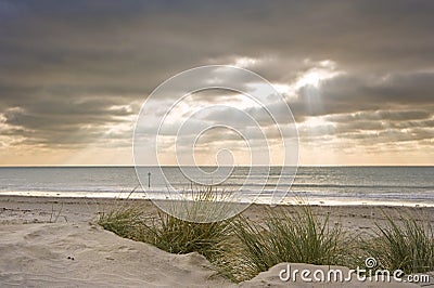 Beautiful inspirational sunset over Winter beach Stock Photo