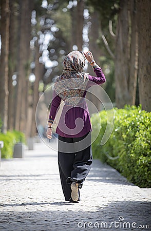 Beautiful iranian woman in Fin gardens Stock Photo
