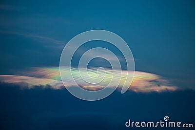 Beautiful iridescent cloud, Irisation or rainbow cloud on sky Stock Photo