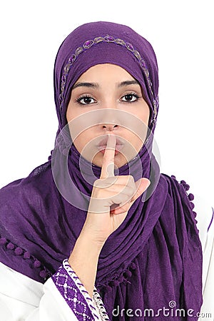 Beautiful islamic woman wearing a hijab asking for silence Stock Photo