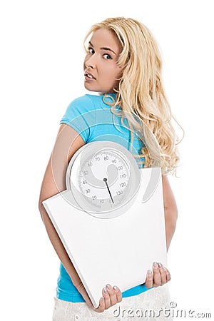 Beautiful isolated young girl with body balance looking desperate. Concept for eating disorders. Stock Photo