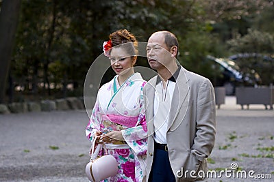 Beautiful Japanese woman kimono man suit Editorial Stock Photo