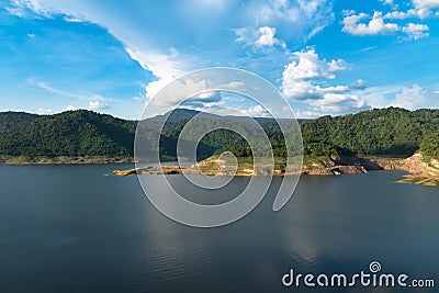 Beautiful Khun Dan Prakarn Chon dam and perfect forest in the clear sky Stock Photo