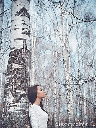 Beautiful lady in a birch forest Stock Photo