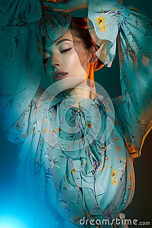 Beautiful lady in blue chiffon dress Stock Photo