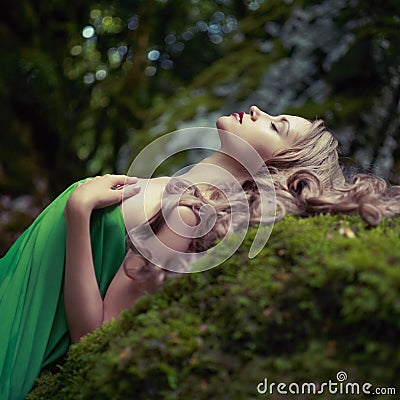 Beautiful lady in the coniferous forest Stock Photo