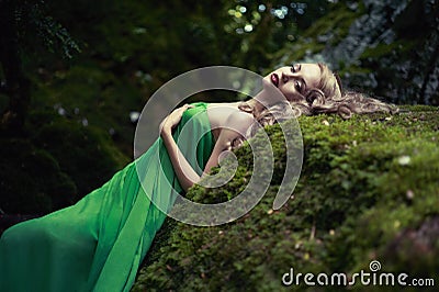 Beautiful lady in the coniferous forest Stock Photo